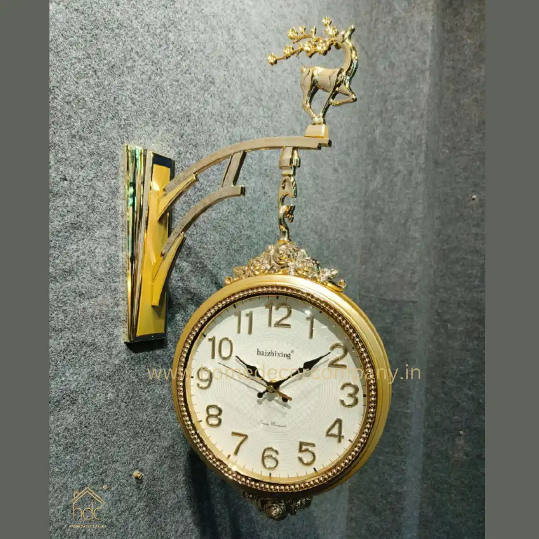 HDC Modern Double-Sided Wall Clock With a Decorative Golden Frame and a Deer Figurine on Top