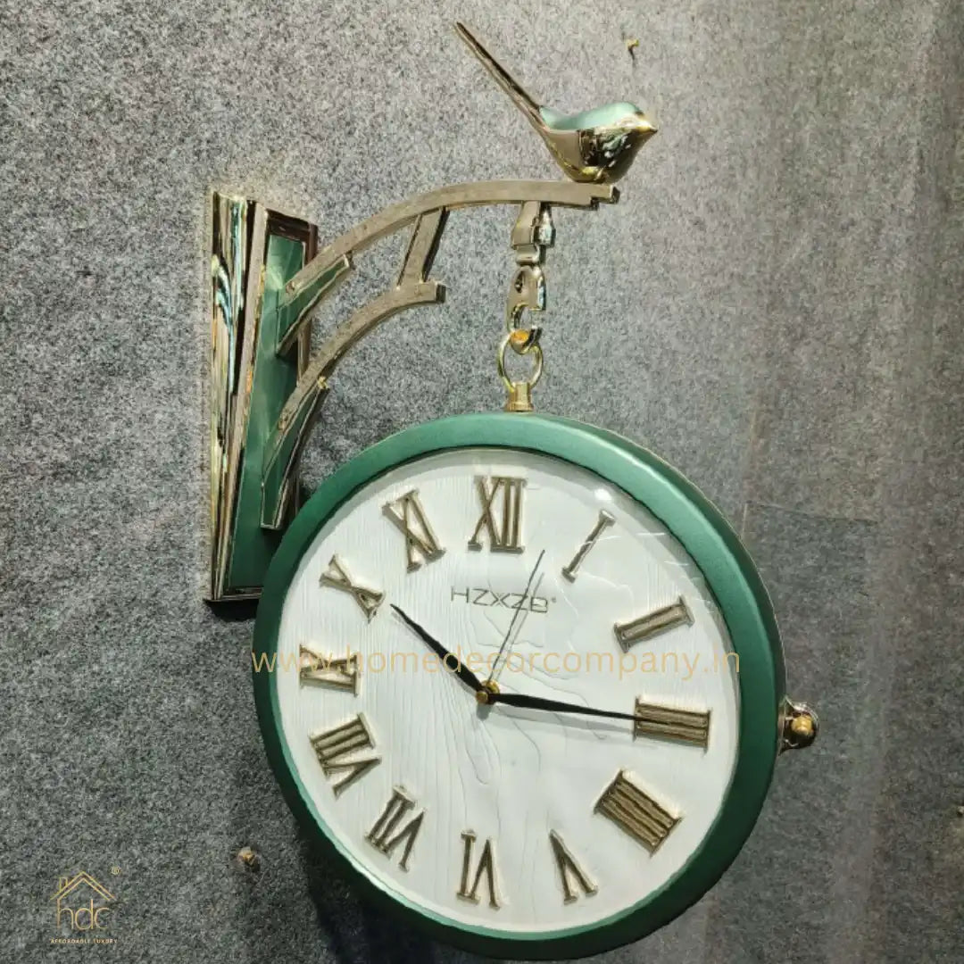 HDC Modern Double-Sided Vintage-Style Station Clock With a Decorative Clock has a Green Frame, a White Face with Roman Numerals Hanging Clock with a Bird Perched on Top