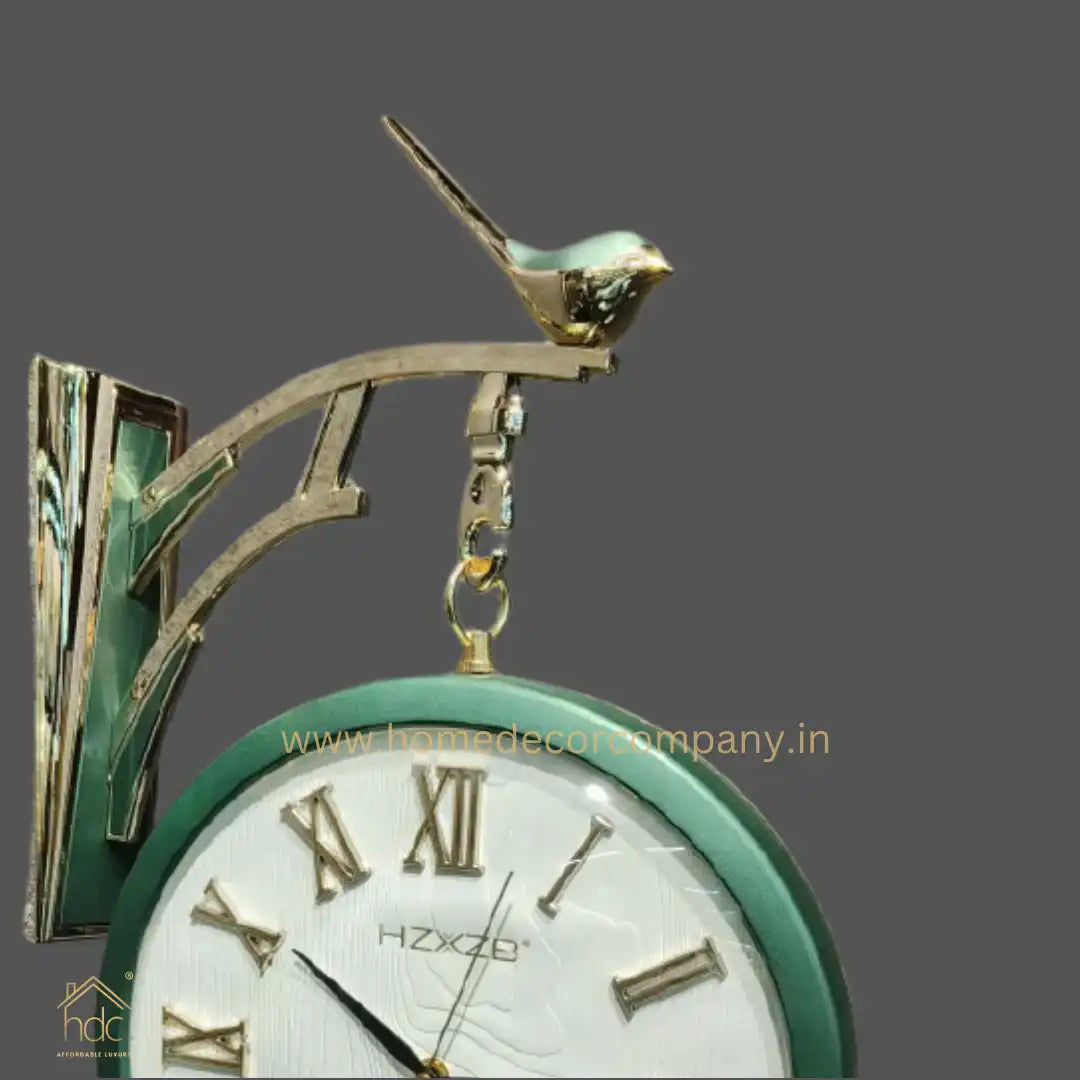 HDC Modern Double-Sided Vintage-Style Station Clock With a Decorative Clock has a Green Frame, a White Face with Roman Numerals Hanging Clock with a Bird Perched on Top
