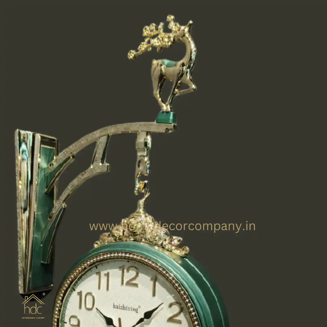 HDC Modern Double-Sided Wall Clock With a Decorative Clock has a Green Casing and a Deer-Shaped Ornament at the Top