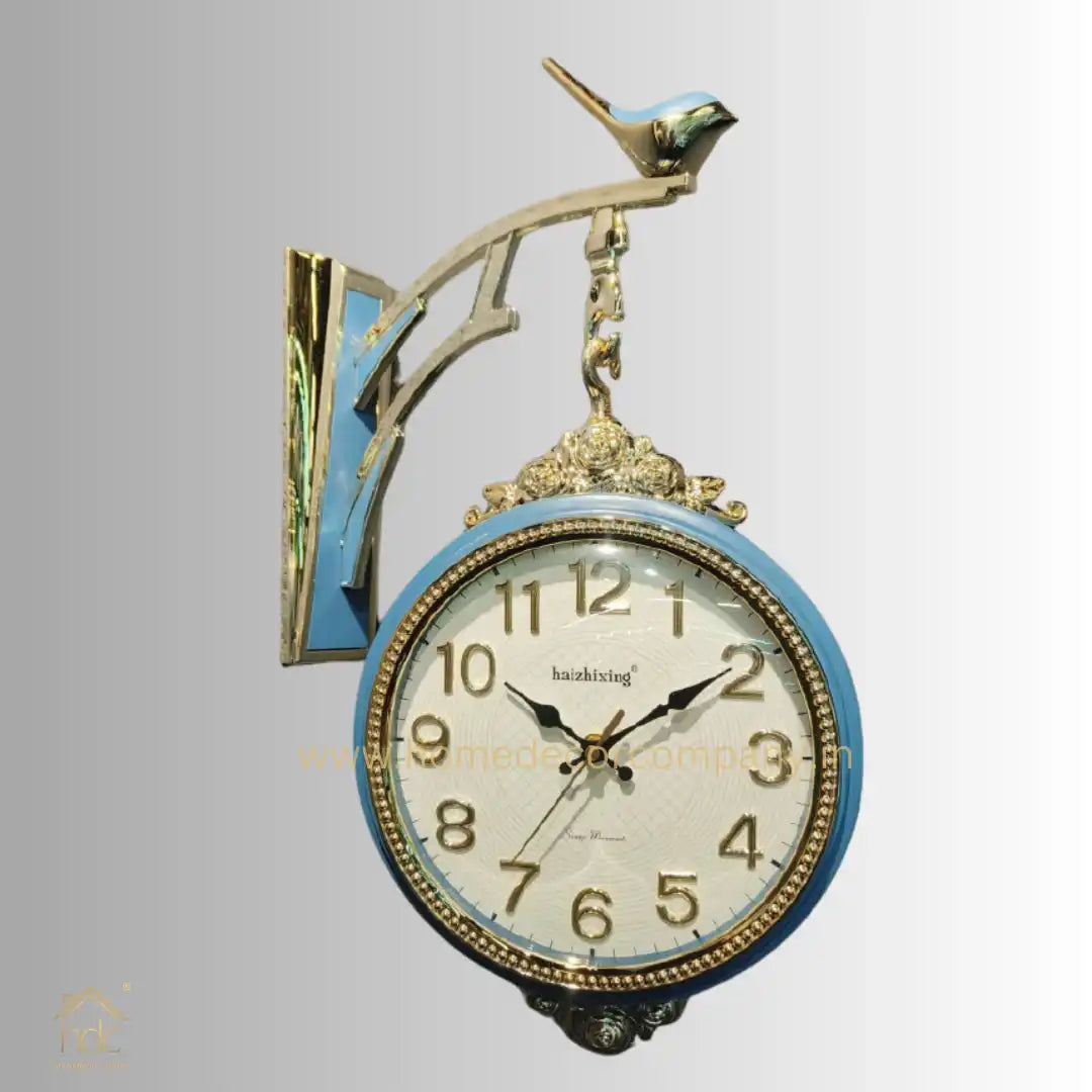 HDC Modern Double-Sided Wall Clock With a Decorative Light Blue Frame With Gold Accents, a Bird-Shaped Ornament on Top