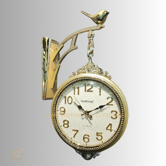HDC Modern Double-Sided Wall Clock With a Decorative Golden Frame With Gold Accents, a Bird-Shaped Ornament on Top