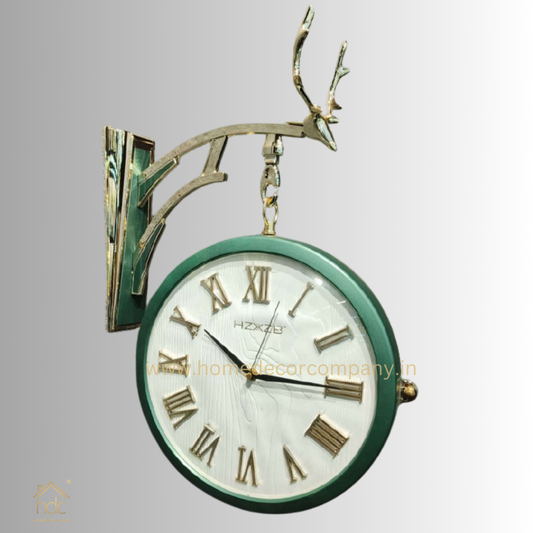HDC Modern Double-Sided Vintage-Style Station Clock With a Decorative Reindeer Design Green Frame, a White Face with Roman Numerals, and Black Hand Reindeer Antlers mount On Top