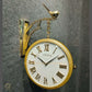 HDC Modern Double-Sided Vintage-Style Station Clock With a Decorative Clock has a Gold Frame, a White Face with Roman Numerals Hanging Clock with a Bird Perched on Top