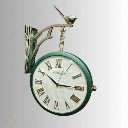 HDC Modern Double-Sided Vintage-Style Station Clock With a Decorative Clock has a Green Frame, a White Face with Roman Numerals Hanging Clock with a Bird Perched on Top